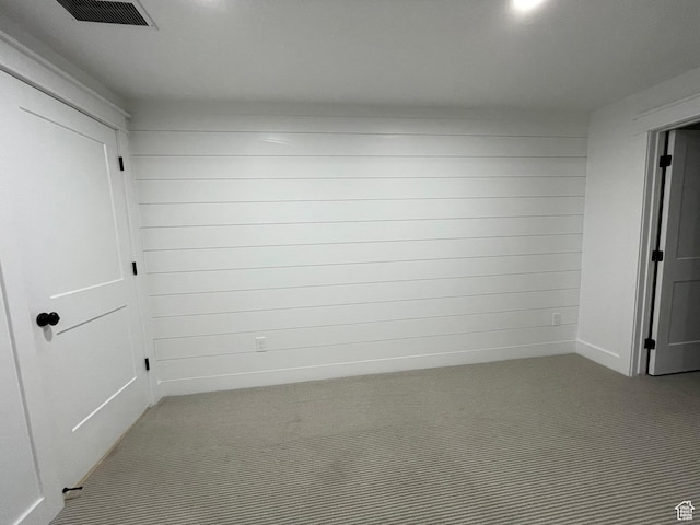 10887 S Lamond Dr, South Jordan, UT 84009 - carpeted spare room featuring visible vents and wooden walls