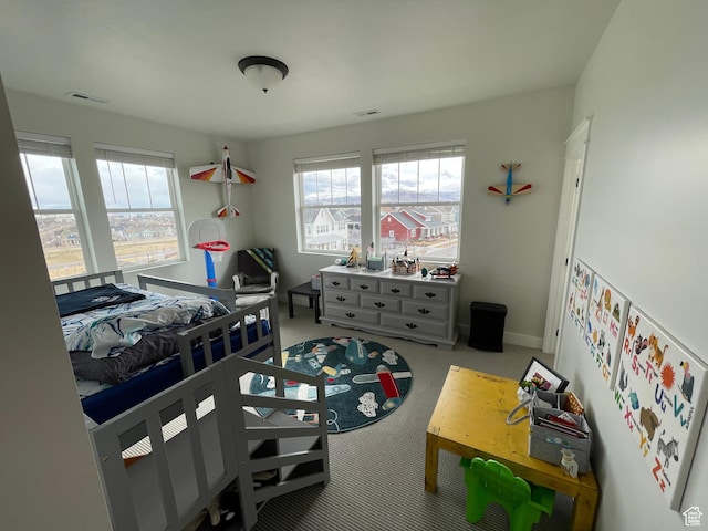 10887 S Lamond Dr, South Jordan, UT 84009 - carpeted bedroom with visible vents, multiple windows, and baseboards