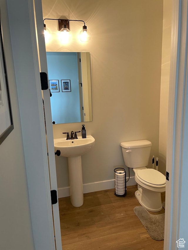 10887 S Lamond Dr, South Jordan, UT 84009 - bathroom with toilet, wood finished floors, baseboards, and a sink
