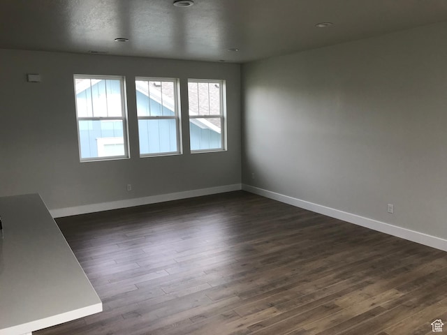 10887 S Lamond Dr, South Jordan, UT 84009 - empty room featuring dark wood finished floors and baseboards