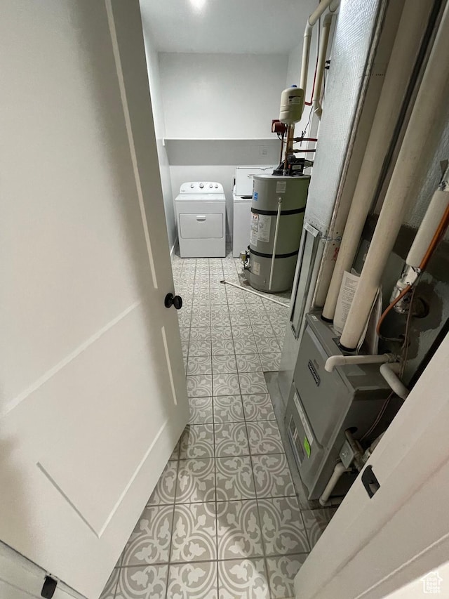 10887 S Lamond Dr, South Jordan, UT 84009 - laundry area with strapped water heater, laundry area, and tile patterned flooring