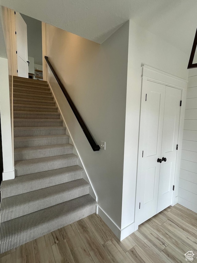 10887 S Lamond Dr, South Jordan, UT 84009 - stairs featuring baseboards and wood finished floors