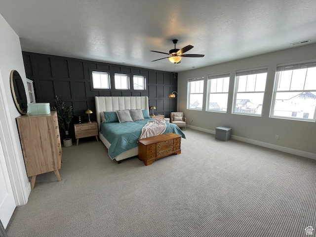 10887 S Lamond Dr, South Jordan, UT 84009 - bedroom featuring visible vents, a textured ceiling, baseboards, light colored carpet, and ceiling fan
