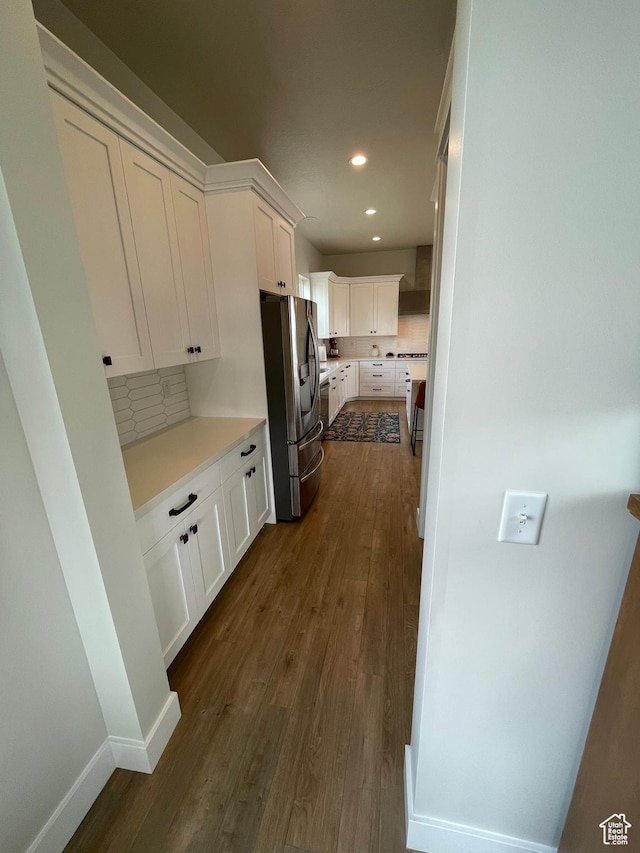 10887 S Lamond Dr, South Jordan, UT 84009 - kitchen with stainless steel refrigerator with ice dispenser, tasteful backsplash, dark wood-style floors, white cabinets, and light countertops