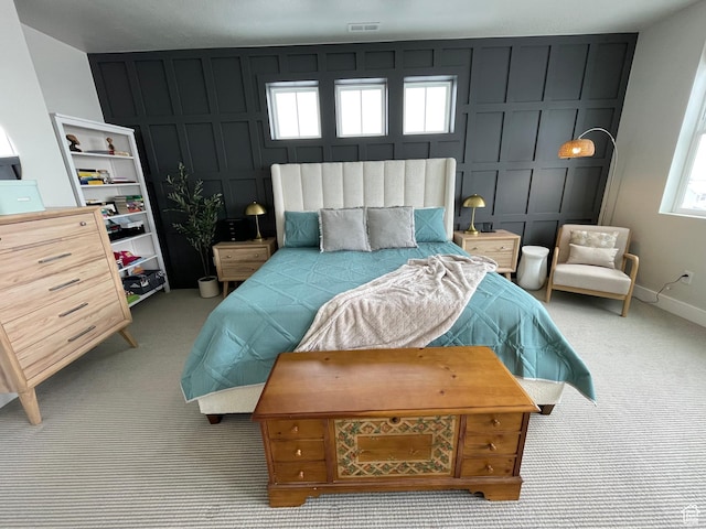10887 S Lamond Dr, South Jordan, UT 84009 - carpeted bedroom with visible vents, baseboards, and a decorative wall
