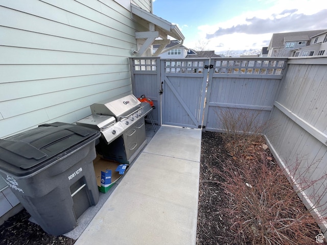 10887 S Lamond Dr, South Jordan, UT 84009 - view of patio / terrace featuring fence and a gate