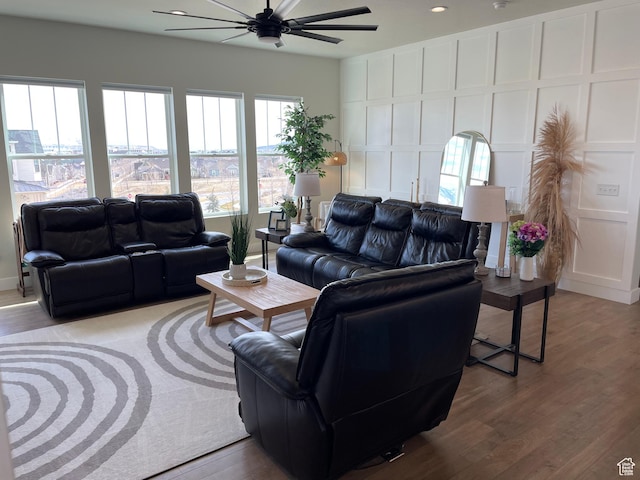 10887 S Lamond Dr, South Jordan, UT 84009 - living area with wood finished floors, ceiling fan, and a decorative wall