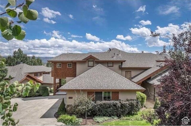 1056 W Lime Canyon Rd, Midway, UT 84049 - view of front of home with a shingled roof and stucco siding