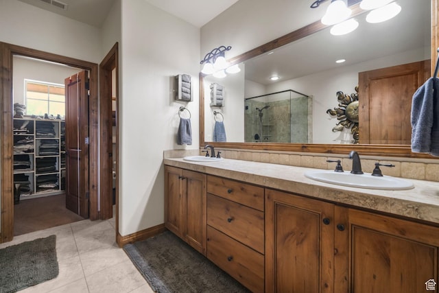 1056 W Lime Canyon Rd, Midway, UT 84049 - full bathroom featuring a shower stall, a sink, tile patterned flooring, and a walk in closet