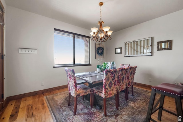 1056 W Lime Canyon Rd, Midway, UT 84049 - dining space with baseboards, a notable chandelier, and hardwood / wood-style flooring