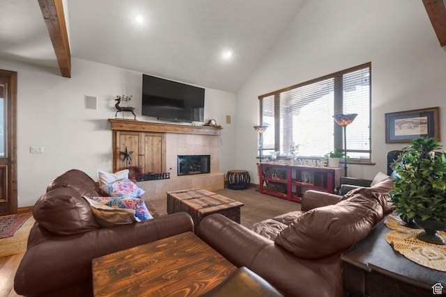 1056 W Lime Canyon Rd, Midway, UT 84049 - carpeted living room featuring high vaulted ceiling, beamed ceiling, a tiled fireplace, and visible vents