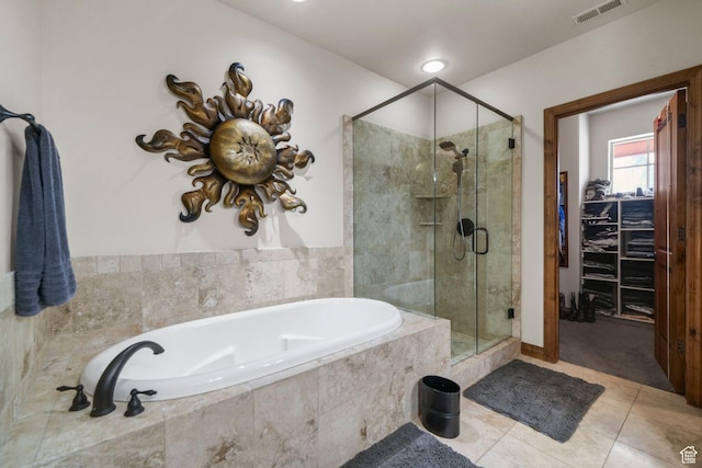 1056 W Lime Canyon Rd, Midway, UT 84049 - bathroom featuring a shower stall, a garden tub, a spacious closet, and visible vents