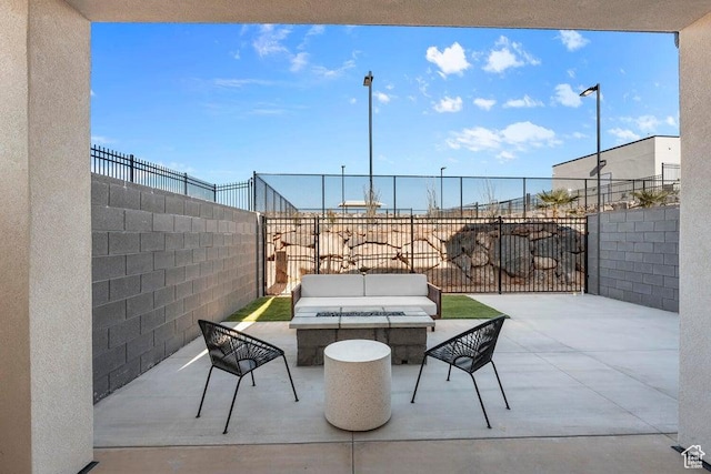 view of patio featuring an outdoor living space and a fenced backyard