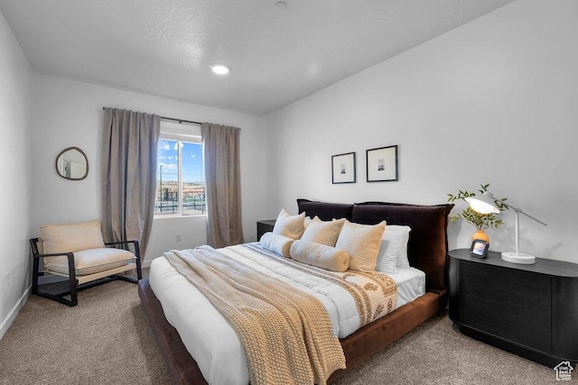 carpeted bedroom with baseboards
