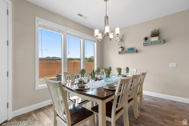 2691 S 3970 W, Hurricane, UT 84737 - dining area with a notable chandelier, visible vents, baseboards, and wood finished floors
