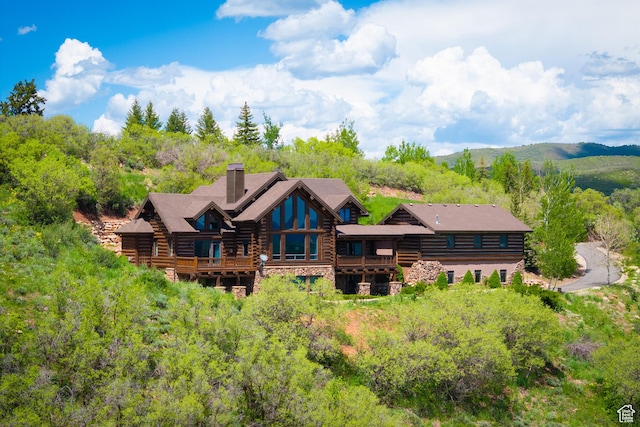 4115 Moose Hollow Loop, Park City, UT 84098 - rear view of property featuring log exterior, a chimney, a balcony, and stone siding