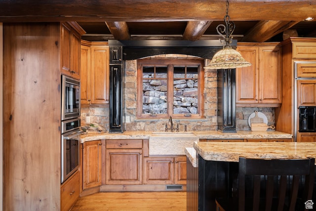 4115 Moose Hollow Loop, Park City, UT 84098 - kitchen with stainless steel appliances, a sink, wooden ceiling with exposed beams, backsplash, and light stone countertops