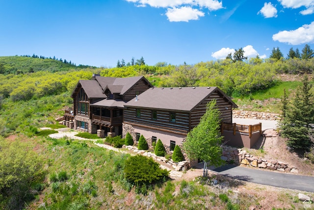 4115 Moose Hollow Loop, Park City, UT 84098 - view of front of home with log exterior, stone siding, and a wooded view