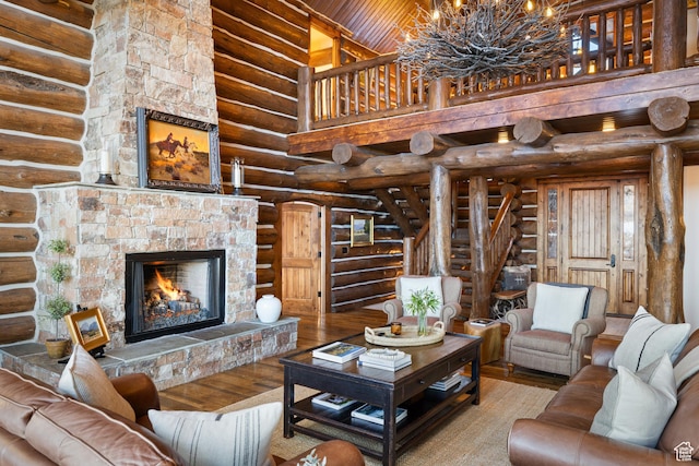 4115 Moose Hollow Loop, Park City, UT 84098 - living room with wood-type flooring, log walls, a stone fireplace, a chandelier, and a towering ceiling