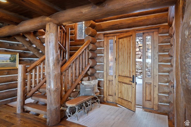 4115 Moose Hollow Loop, Park City, UT 84098 - foyer entrance with stairs, wood finished floors, log walls, and wooden ceiling with exposed beams