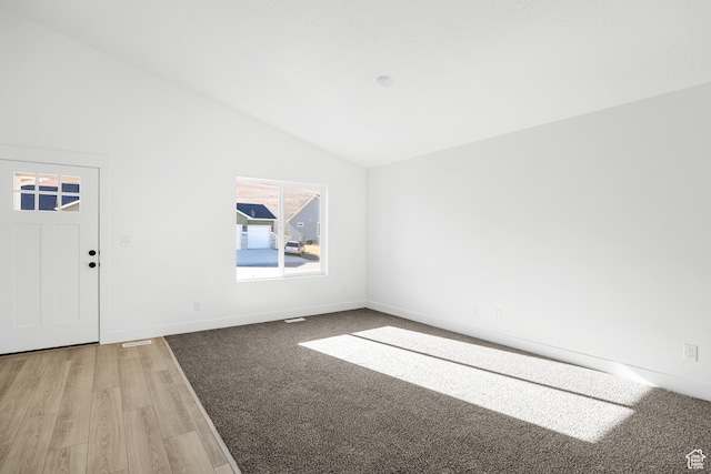1667 S Marigold Way Unit 230E, Santaquin, UT 84655 - spare room with baseboards, vaulted ceiling, and light wood-type flooring