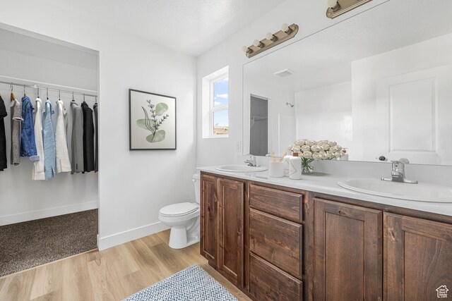 1667 S Marigold Way Unit 230E, Santaquin, UT 84655 - full bath featuring double vanity, wood finished floors, and a spacious closet