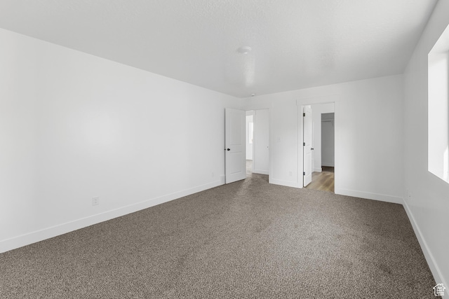 1667 S Marigold Way Unit 230E, Santaquin, UT 84655 - spare room with carpet flooring and baseboards