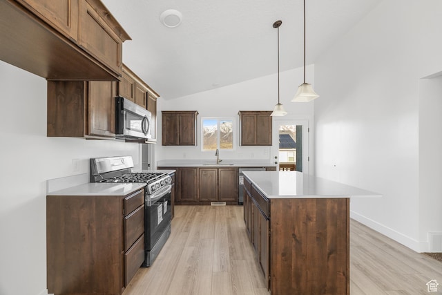 1667 S Marigold Way Unit 230E, Santaquin, UT 84655 - kitchen featuring a sink, stainless steel appliances, a center island, and light wood-type flooring