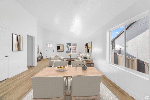 1667 S Marigold Way Unit 230E, Santaquin, UT 84655 - dining area with light wood-type flooring and vaulted ceiling