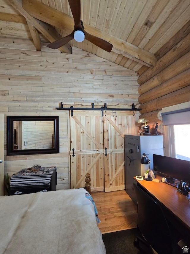 365 W Sleeping Rainbow Dr, Torrey, UT 84775 - bedroom featuring wooden ceiling, vaulted ceiling with beams, a barn door, wood finished floors, and log walls