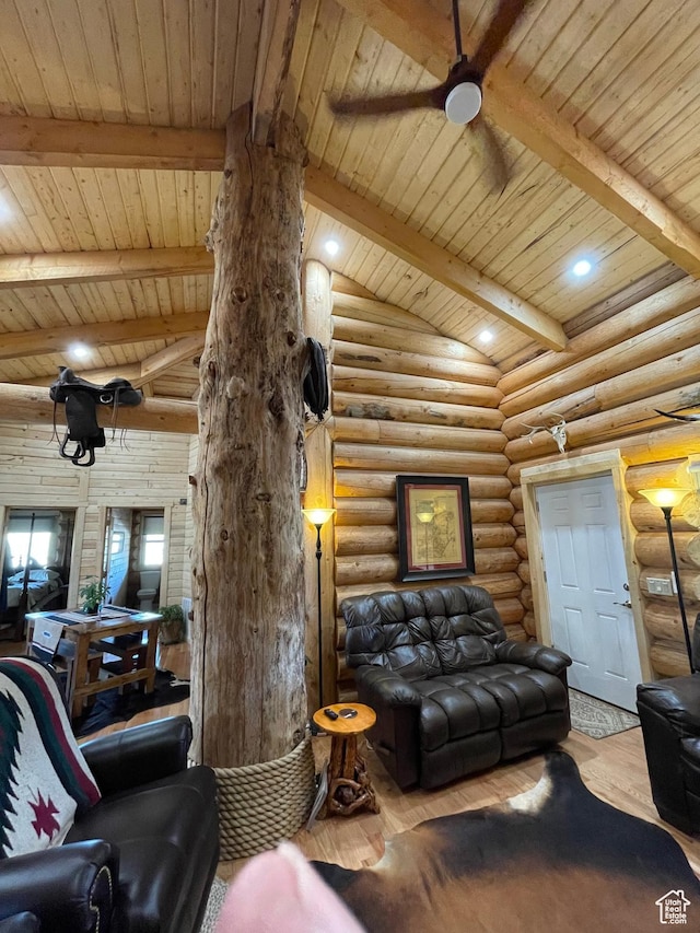 365 W Sleeping Rainbow Dr, Torrey, UT 84775 - living room featuring a ceiling fan, lofted ceiling with beams, log walls, and wood finished floors
