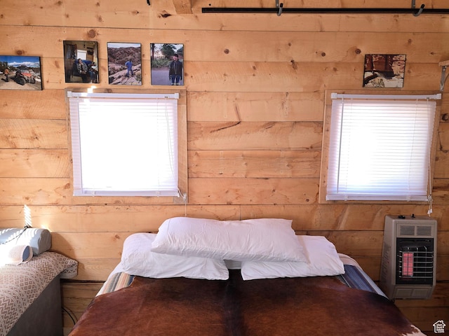 365 W Sleeping Rainbow Dr, Torrey, UT 84775 - bedroom featuring heating unit, wood walls, and multiple windows