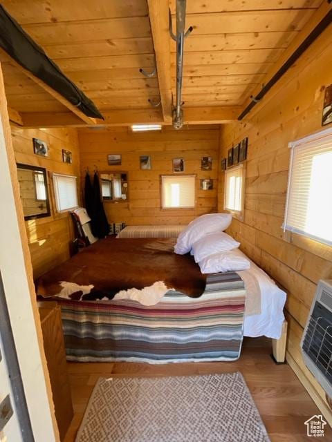 365 W Sleeping Rainbow Dr, Torrey, UT 84775 - bedroom with multiple windows, beam ceiling, wooden ceiling, and wood walls