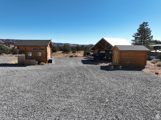 365 W Sleeping Rainbow Dr, Torrey, UT 84775 - exterior space featuring an outdoor structure and a mountain view