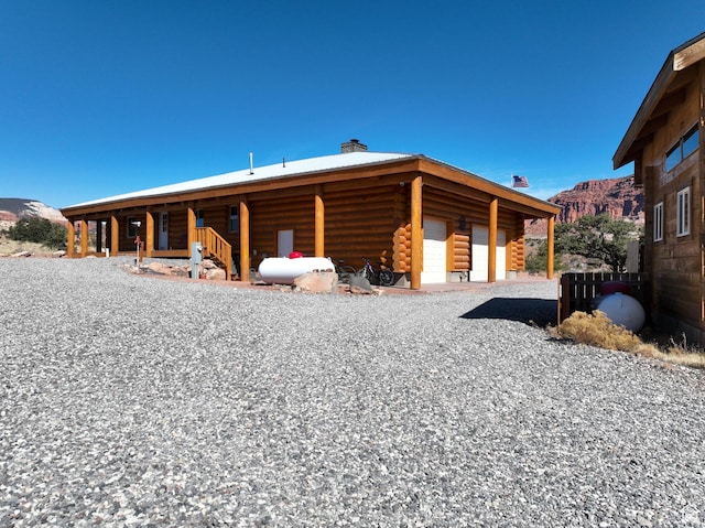 365 W Sleeping Rainbow Dr, Torrey, UT 84775 - exterior space with a chimney, a mountain view, and log exterior