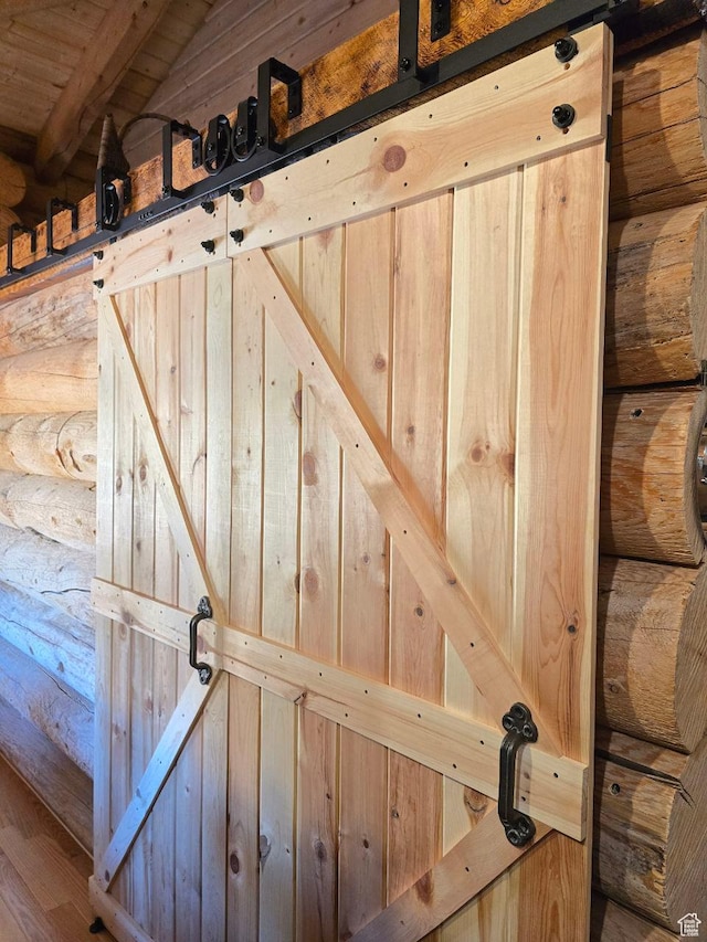 365 W Sleeping Rainbow Dr, Torrey, UT 84775 - room details with a barn door and rustic walls