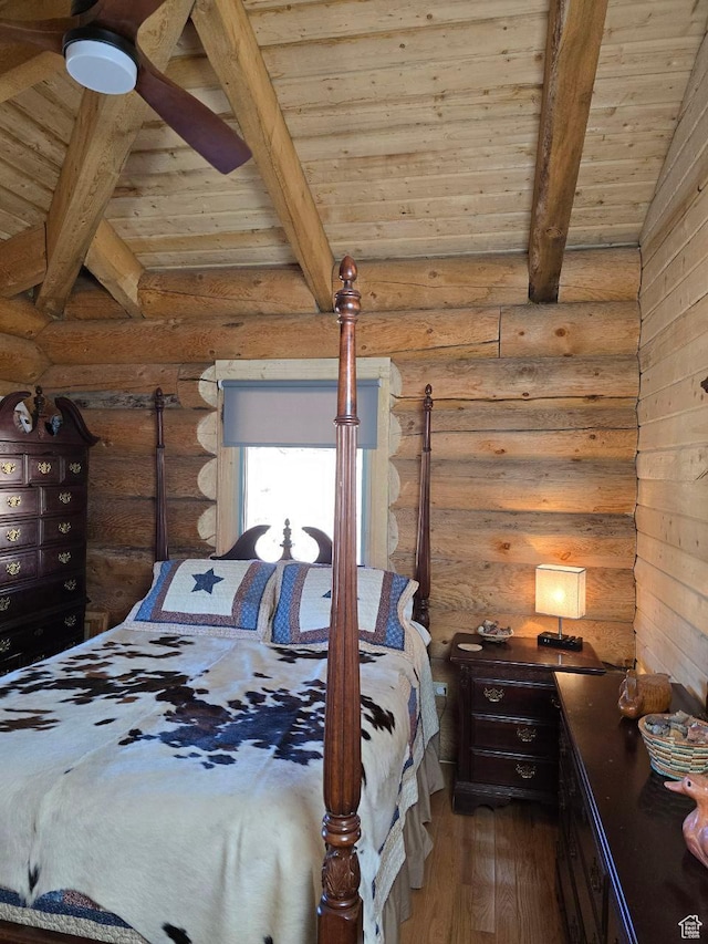 365 W Sleeping Rainbow Dr, Torrey, UT 84775 - bedroom with lofted ceiling with beams, wooden ceiling, log walls, and wood finished floors