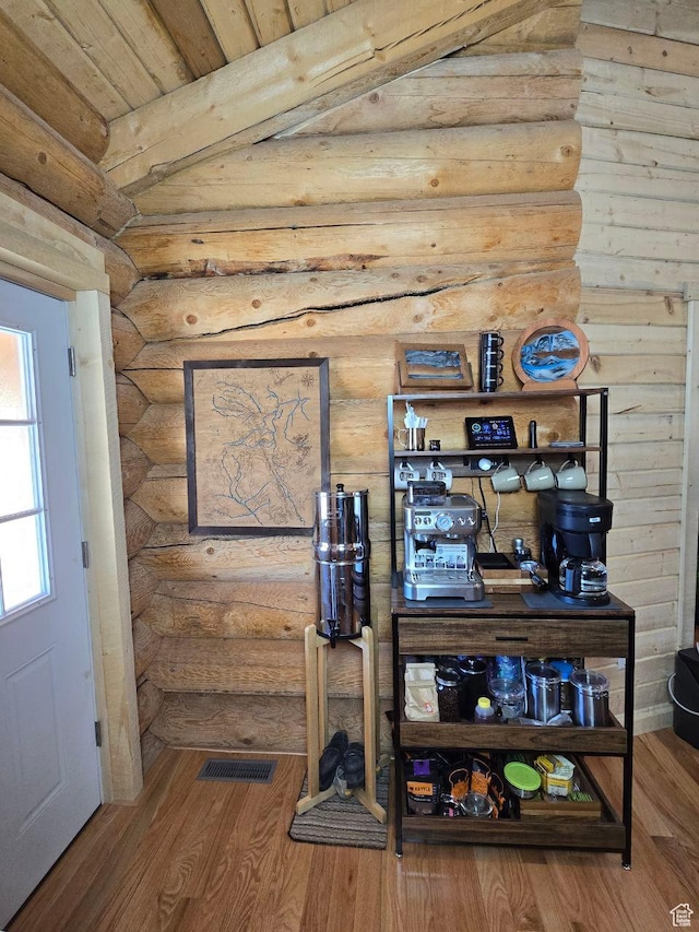 365 W Sleeping Rainbow Dr, Torrey, UT 84775 - room details featuring visible vents, log walls, and wood finished floors