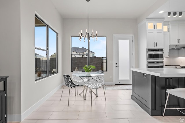 1036 E Fremont St, Washington, UT 84780 - dining space with baseboards and an inviting chandelier