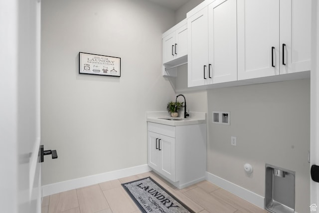 1036 E Fremont St, Washington, UT 84780 - clothes washing area with cabinet space, hookup for a washing machine, baseboards, and a sink