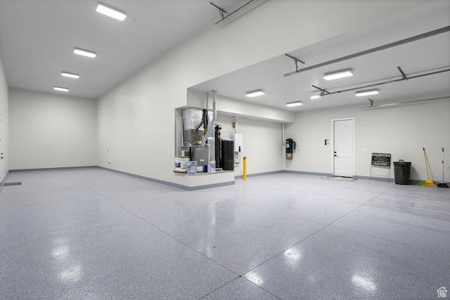 1036 E Fremont St, Washington, UT 84780 - garage featuring heating unit and baseboards