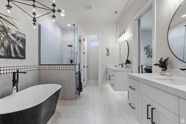 1036 E Fremont St, Washington, UT 84780 - full bath featuring a tile shower, a soaking tub, visible vents, and a sink