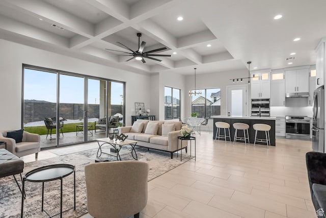 1036 E Fremont St, Washington, UT 84780 - living area featuring beamed ceiling, recessed lighting, ceiling fan with notable chandelier, and coffered ceiling
