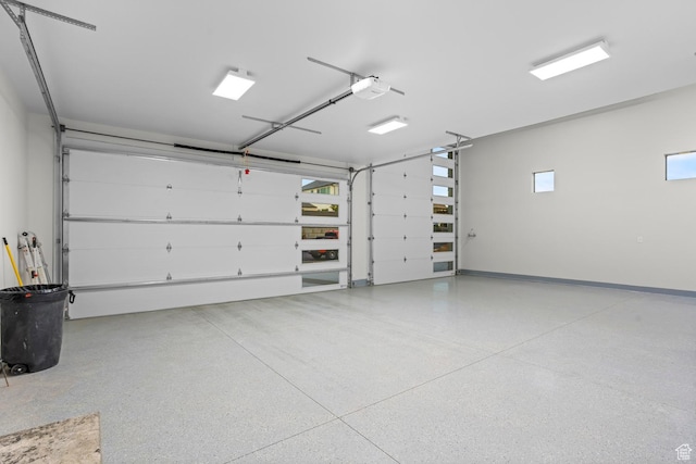1036 E Fremont St, Washington, UT 84780 - garage featuring a garage door opener and baseboards