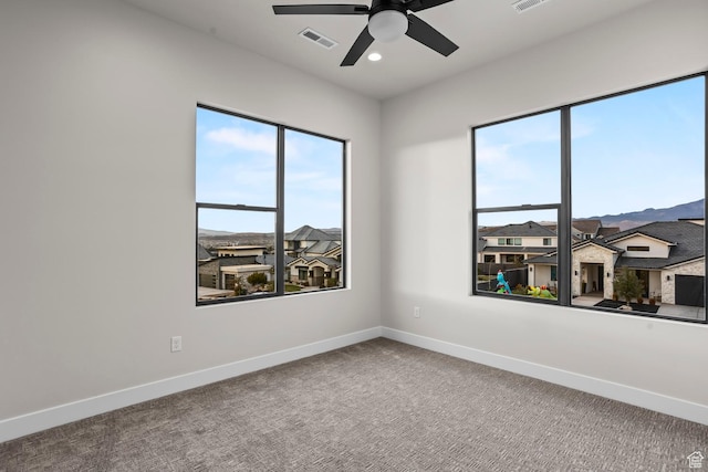 1036 E Fremont St, Washington, UT 84780 - spare room featuring visible vents, baseboards, carpet, and ceiling fan