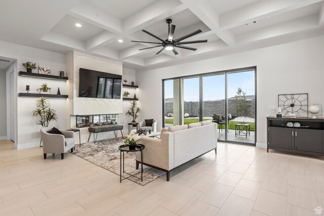 1036 E Fremont St, Washington, UT 84780 - living area featuring beamed ceiling, a ceiling fan, baseboards, and coffered ceiling