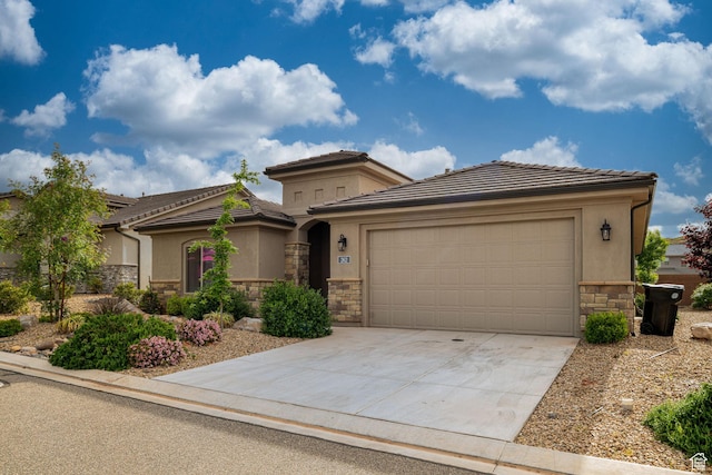 262 Ladera Dr, Washington, UT 84780 - view of front of property with a tiled roof, an attached garage, stone siding, concrete driveway, and stucco siding