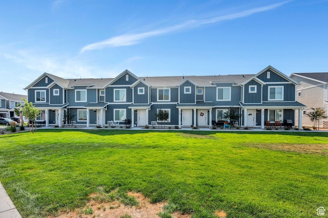 388 N Regatta Ln, Saratoga Springs, UT 84045 - view of front of property with a residential view, board and batten siding, and a front lawn