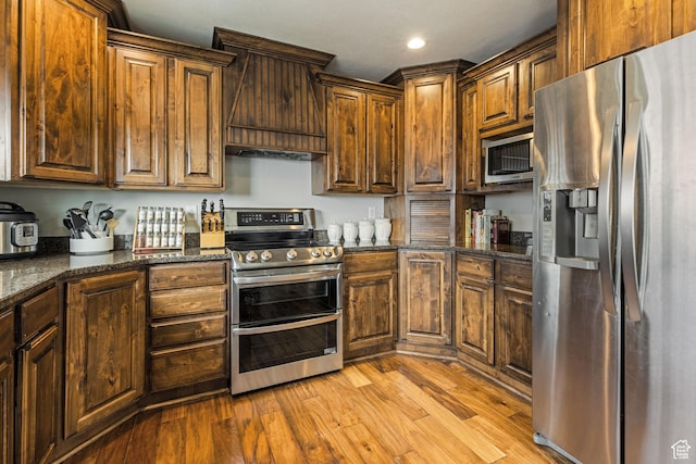 1035 E 300 S, Santaquin, UT 84655 - kitchen featuring recessed lighting, appliances with stainless steel finishes, dark stone countertops, and light wood-type flooring