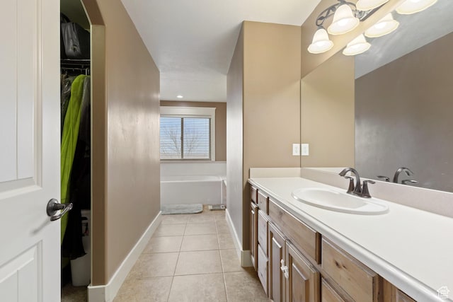 1035 E 300 S, Santaquin, UT 84655 - full bath with a bath, tile patterned flooring, baseboards, vanity, and a spacious closet